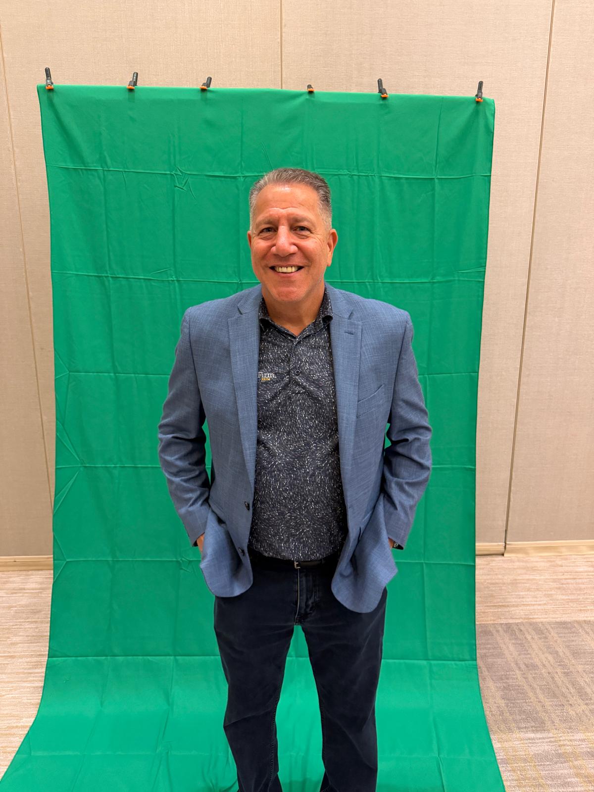 Josh Konigsberg in front of the green screen